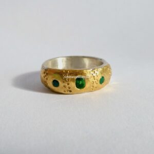 Textured Eclipse Ring; silver, 24ct, tsavorite garnet and emeralds. Size P