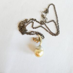 Acorn necklace with 11mm gold South Sea pearl; silver, and 9ct rose gold. Length 46cm