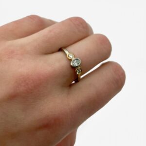 Chloris Ring; platinum and 24ct gold, brilliant and oval F VS diamonds total weight .5ct