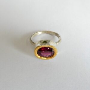 Tanzanian garnet 10x8mm Empress ring with green sapphires. Silver and 24ct gold, size R