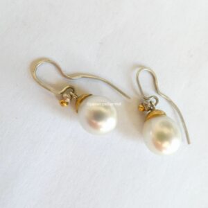 White South Sea pearl earrings with pink tinge. Pearl length 12mm; silver and 24ct gold.