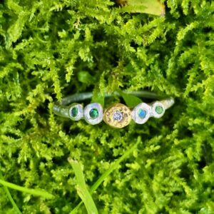 Buds in a row; tsavorite garnets, diamond, silver and 24ct gold. Size L 1/2