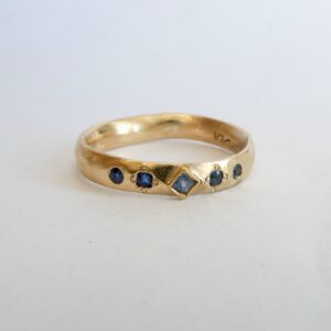 Soft curve ring; 9ct and 24ct gold with Ceylon sapphires.