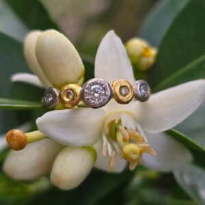 Buds in a Row; 18ct and 24ct gold, silver, natural yellow and white diamonds. Size M 1/2