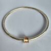 Roller Bangle; 3.5mm solid silver with 9ct red gold and silver. Internal diameter 64mm - Image 3