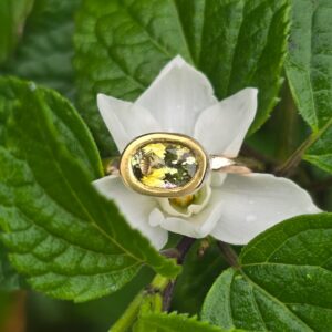 Green tourmaline empress ring with pink sapphire; silver, 18ct pink and 24ct gold. Size M .