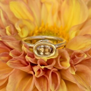 Imperial topaz and sapphire empress ring; silver, 24ct and 18ct pink gold. Size Q