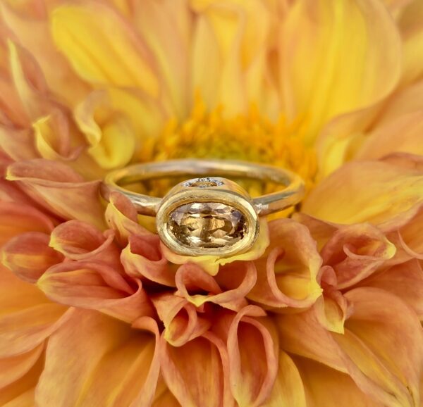 Imperial topaz and sapphire empress ring; silver, 24ct and 18ct pink gold. Size Q