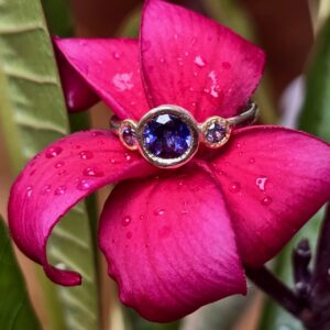 Chloris Ring; iolite with lilac spinel, 24ct, 18ct, 9ct and silver. Size O