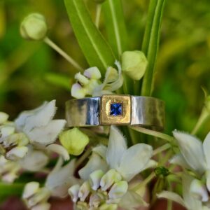 Ceylon sapphire princess cut frame ring; soft curve silver band and 24ct gold. Size O