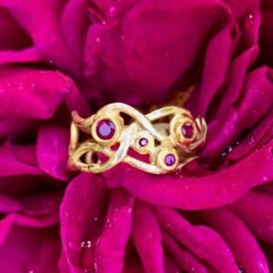 Heart vine ring; 18ct and 24ct gold with rubies.
