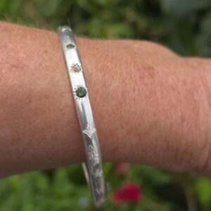 Shine brightly bangle, green sapphire and imperial topaz in a 5mm x 3mm elliptical sterling silver. internal diameter 64.5mm.