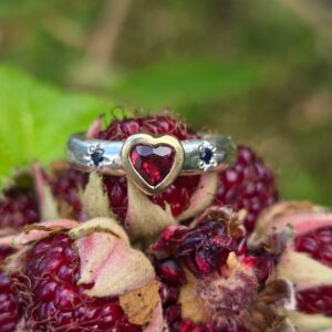 Garnet heart star struck ring with ruby, sapphire, silver, and 18ct gold. Size M 1/2