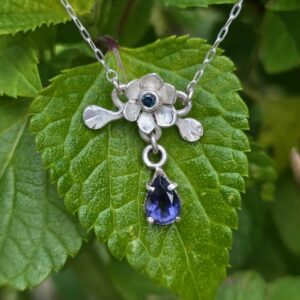 Budding lotus necklace; hand cut sterling silver, unheated Australian teal sapphire and iolite. Length 43cm