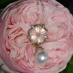 Rose quartz custom blossom cut with baroque fresh water pearl necklace; silver. Necklace length 48cm, pendant length 3.5cm.