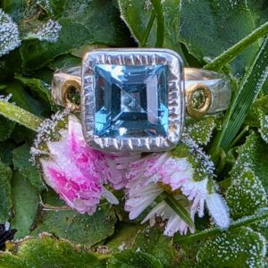 Chloris ring; princes topaz with green sapphire, silver, fine silver and 24ct gold. Size O